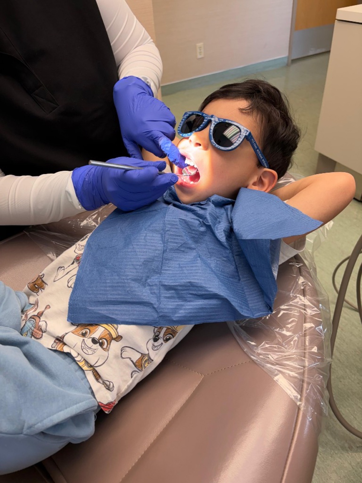 Young patient receiving a gentle dental exam at Lawrence Park Dentistry