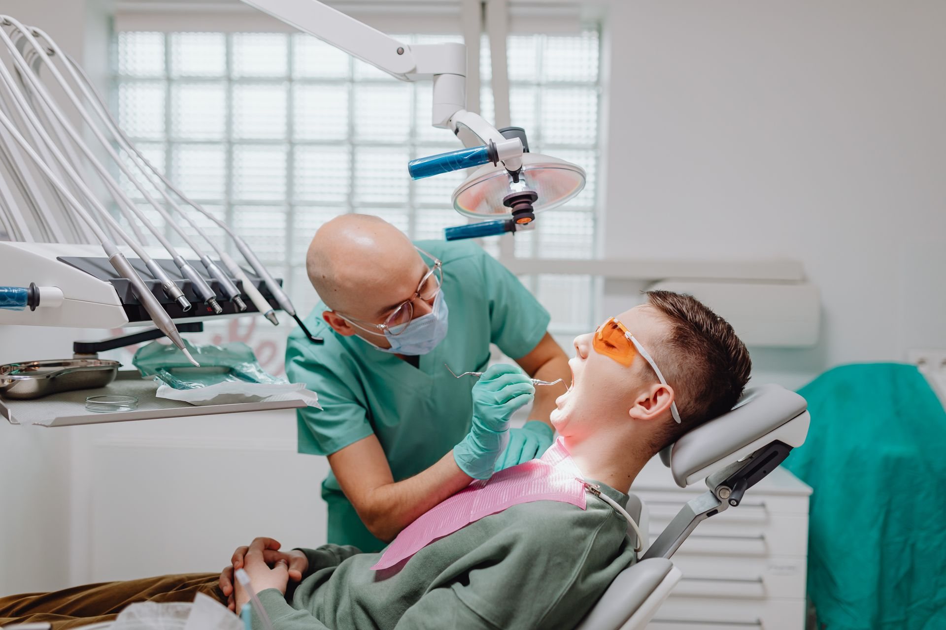 Dentist treating a patient in the chair at Lawrence Park Dentistry